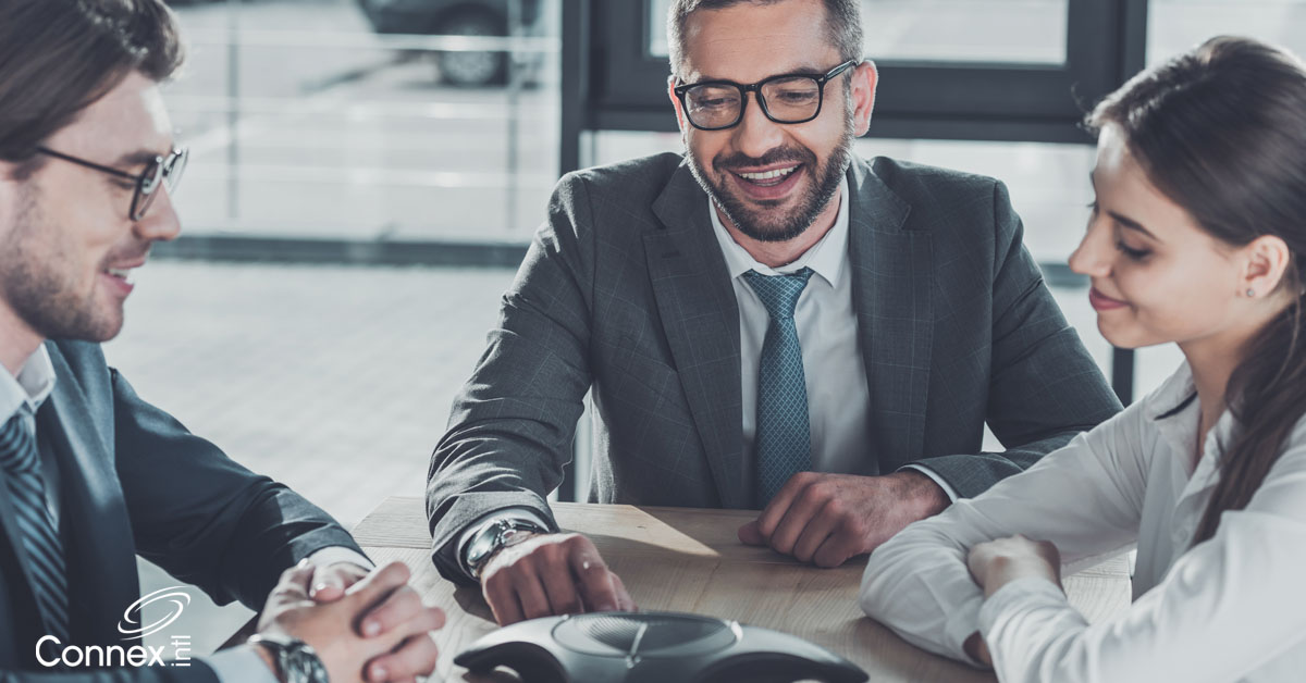 A business team using audio conferencing for building relationships