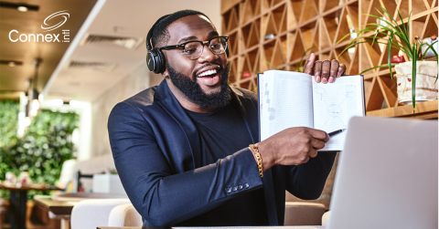 A man on a virtual call with employees practicing virtual icebreakers